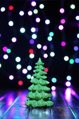 Wall Mural - Little Christmas tree in front of lights