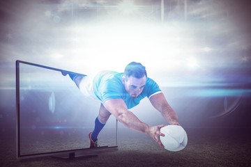 Canvas Print - Composite image of rugby player scoring a try