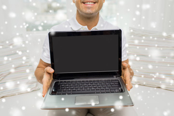 Poster - close up of happy man showing laptop at home