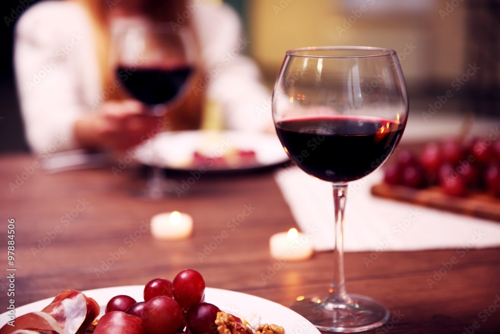 Glass with red wine on the table