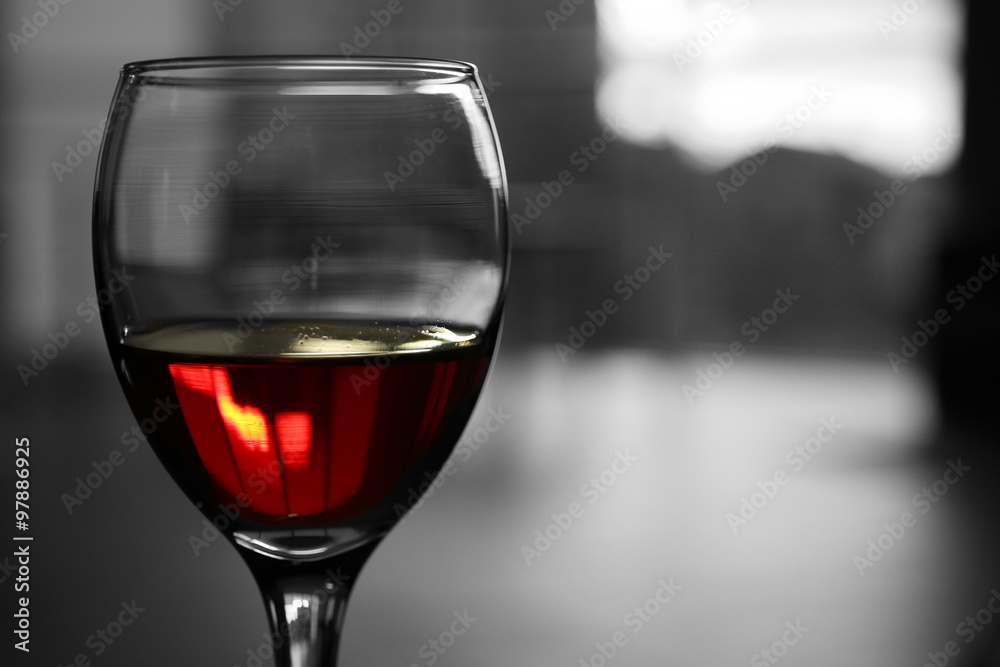 Glass of red wine on blurred background