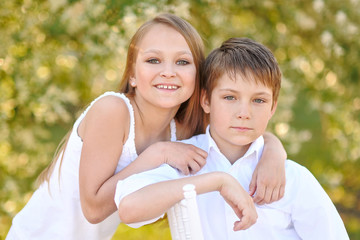 Wall Mural - Portrait of a boy and girl  in summer