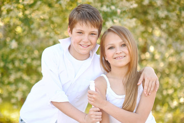 Wall Mural - Portrait of a boy and girl  in summer