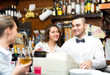 © JackF - Beautiful employees working in bar