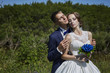 © vasilievae - Wedding bride and groom in beautiful dresses on the nature of th