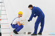 © Africa Studio - Workers renewing apartment on wall background