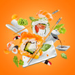 Delicious pieces of sushi, isolated on orange background