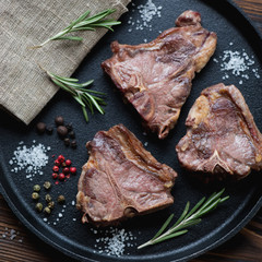 Poster - Close-up of grilled T-bone lamb steaks, view from above