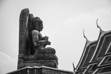 Wall Mural - Sitting buddha stne statue. Black and white image