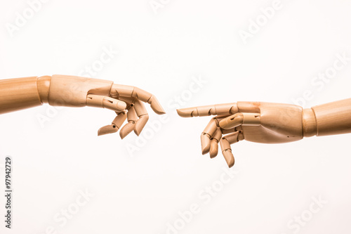 Fotografía Two-handed wooden parody the birth of Adam by Michelangelo