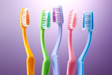 A Group Of Colorful Toothbrushes