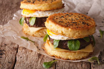 New fast food: ramen burger close-up on the wooden table. horizontal
