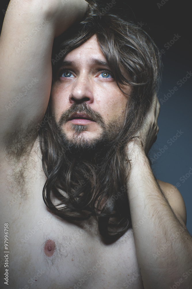 handsome sexy naked man with long dark hair, intense eyes and bl Stock Photo Adobe Stock