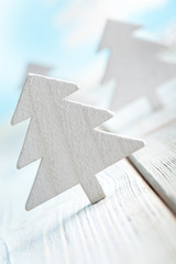 Sticker - Christmas trees on wooden and blue background