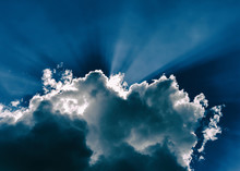 Horizontal Blue Dramatic Cloudscape With Rays Of Light Abstracti