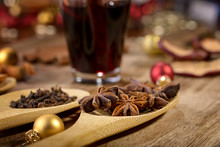 Star Anise And Cloves On Wooden Spoon And Christmas Balls, Wine, Cinnamon, Dried Apple For Christmas