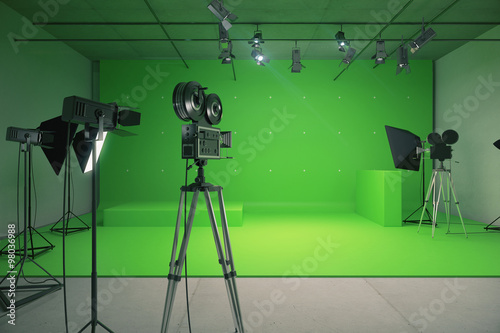 Fotografía Modern empty green photo studio with old style movie camera