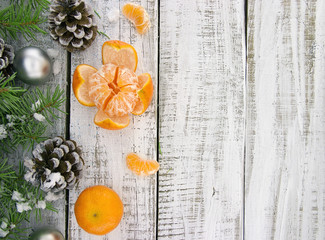 Wall Mural - Composition with decorated Christmas tree, pinecone and mandarin