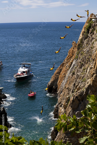 Fotografia, Obraz Composite of the famous cliff diver of Acapulco Mexico