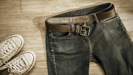 Wall Mural - Blue jeans and dirty white sneaker shoes  on the floor