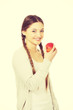 © Piotr Marcinski - Teenage woman holding an apple.