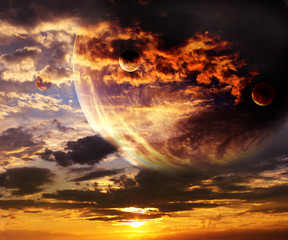 Canvas Print - sky with storm clouds and four planets