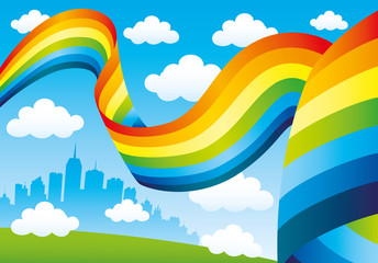 Canvas Print - Rainbow and clouds in the blue sky and the city on the horizon.