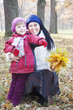 © lozochka - Mother and children in the fall