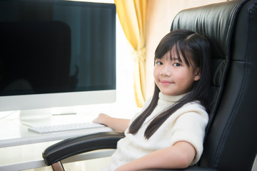 Wall Mural - asian girl using computer