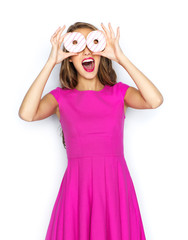 Wall Mural - happy woman or teen girl having fun with donuts