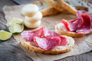 Wall Mural - Ciabatta sandwiches with fuet and mini cheese