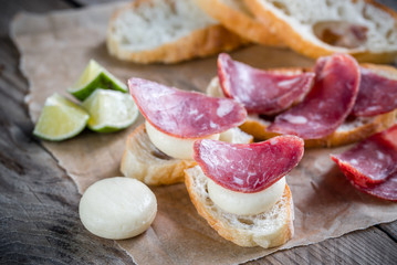 Canvas Print - Ciabatta sandwiches with fuet and mini cheese