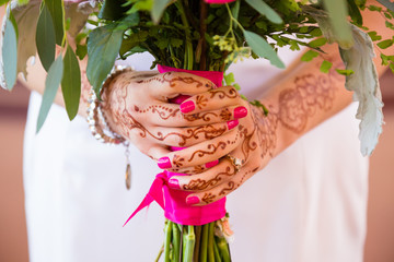 Bride Holding Bouquet of Flowers