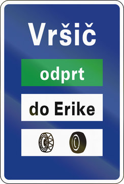 Slovenian road sign - Road closure and tyre requirement information board. Vrsic is the place name, odprt means open, do Erike means to Erike