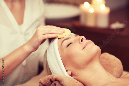 Fototapeta na wymiar close up of woman having face cleaning in spa