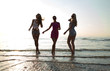 © Syda Productions - happy female friends dancing on beach