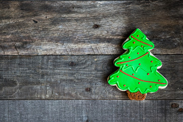 Christmas tree cookie on wooden background