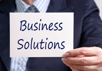 Wall Mural - Business Solutions - Manager holding sign with text