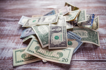 money isolated on a wooden background