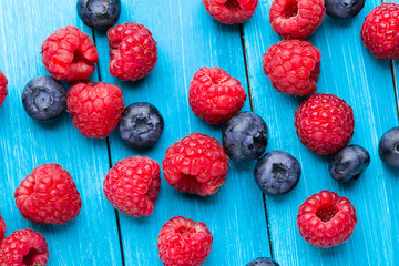 Summer berries on wooden background