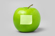 Green Apple and blank note on white background