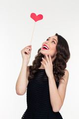 Sticker - Portrait of cheerful retro styled young woman with heart booth