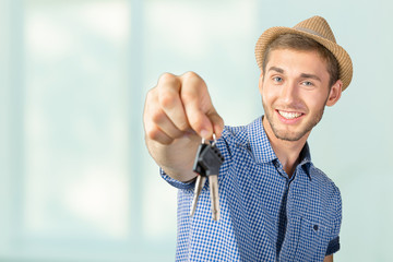 Attractive teenage boy holding car keys