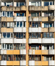Dirty Facade With Balconies And Windows.