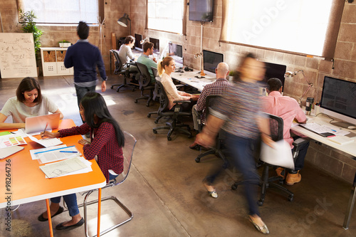 Fotografía Elevated View Of Workers In Busy Modern Design Office