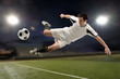 © Carlos Santa Maria - Soccer player jumping and kicking
