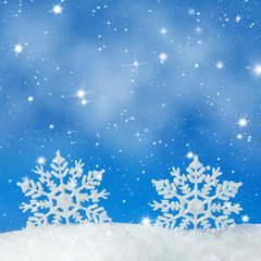 Wall Mural - christmas background with two decorative snowflakes in snow
