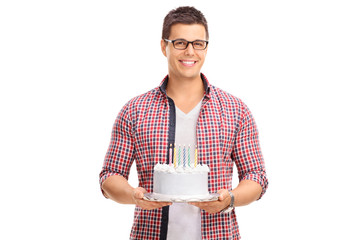 Canvas Print - Cheerful young guy holding a birthday cake