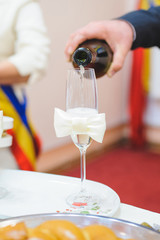 Wall Mural - Man Filling Glass with Champagne