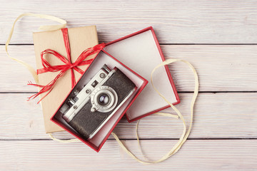 Wall Mural - Top view of vintage camera in open gift box